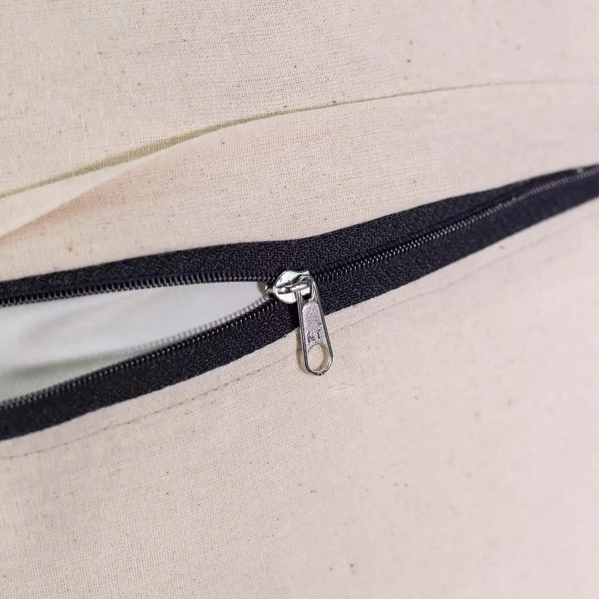 Vindigo cushion cover back view showing black zipper on white hemp