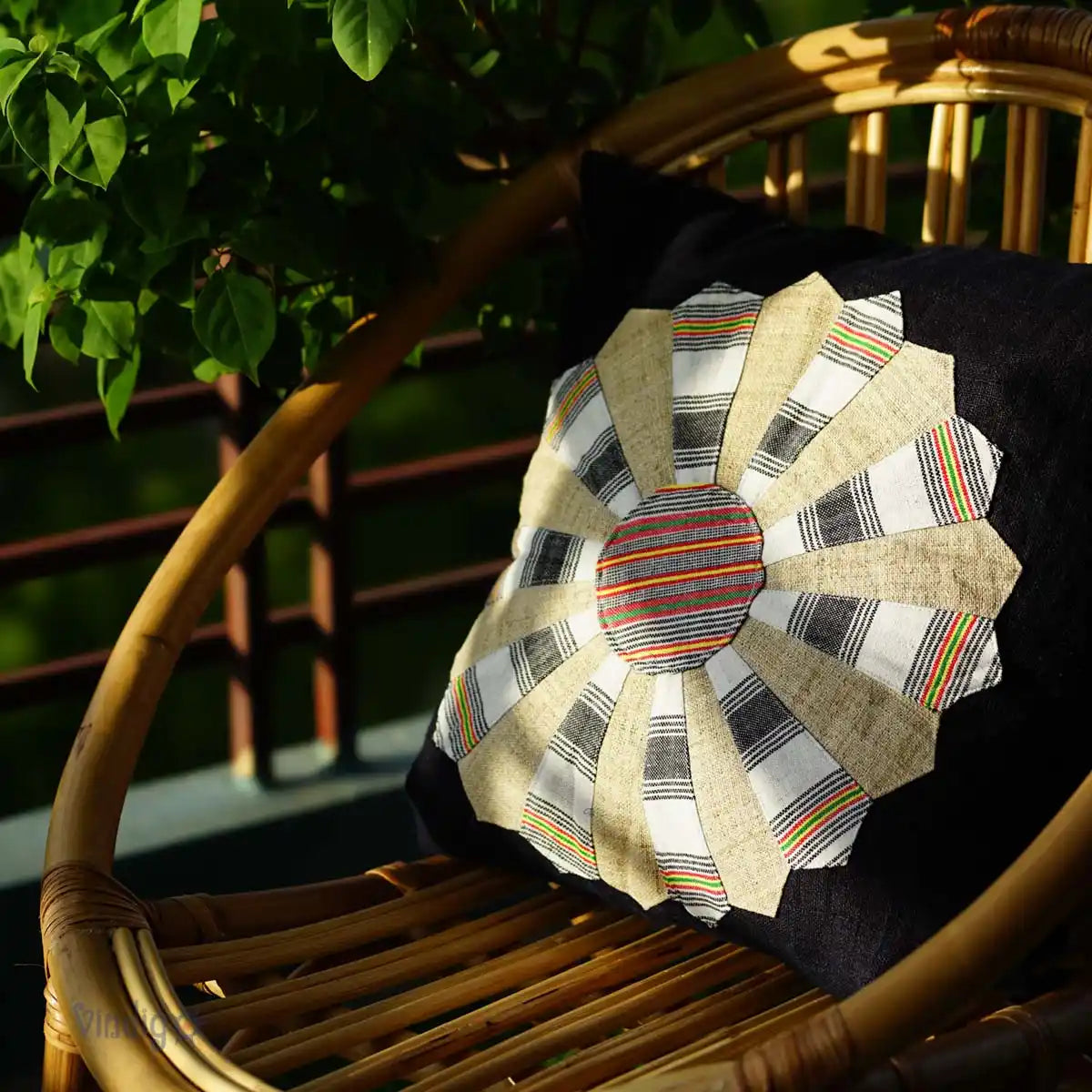 Vindigo indigo hemp cushion with Dresden Plate pattern on wooden chair