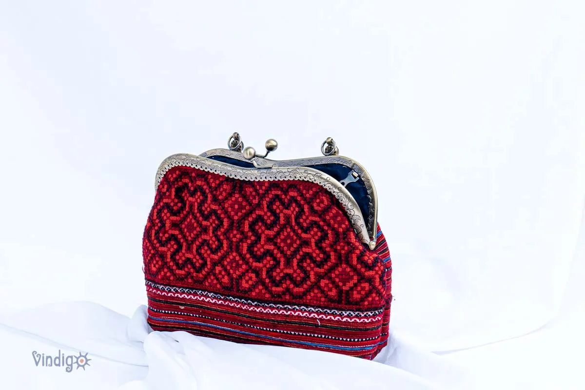 Vindigo red vintage embroidered handbag side angle showing curved frame