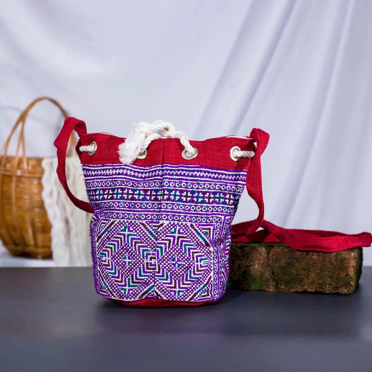 Vindigo red hemp geometric bucket bag standing upright