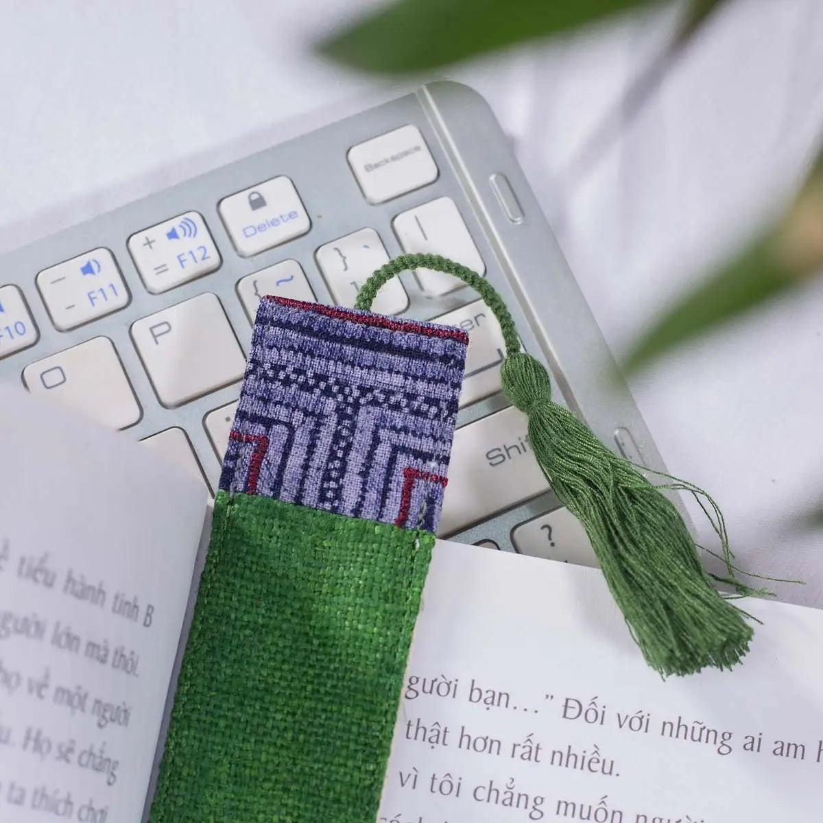 Vindigo green hemp tribal pattern bookmark beside keyboard