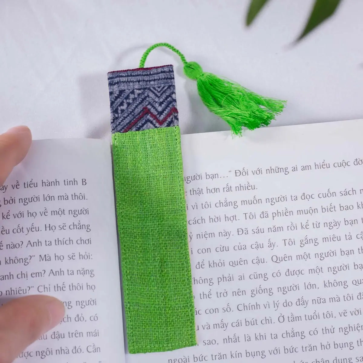 Vindigo handmade light green hemp batik bookmark close-up on book page