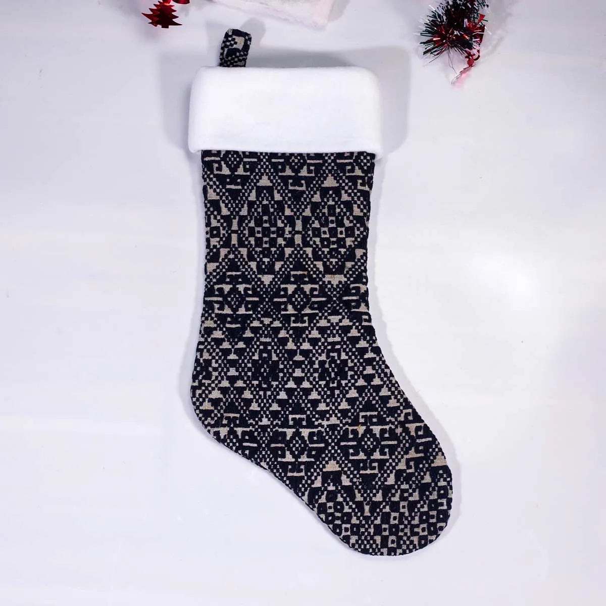 Vindigo black hand-embroidered Christmas stocking with white top front view