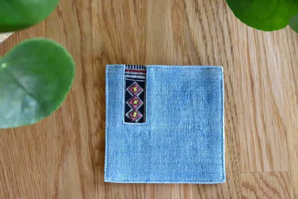 Close-up showing stitching texture of light denim tribal coaster