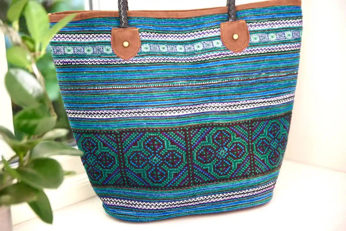 Close-up of woven tribal patterns on blue hemp tote