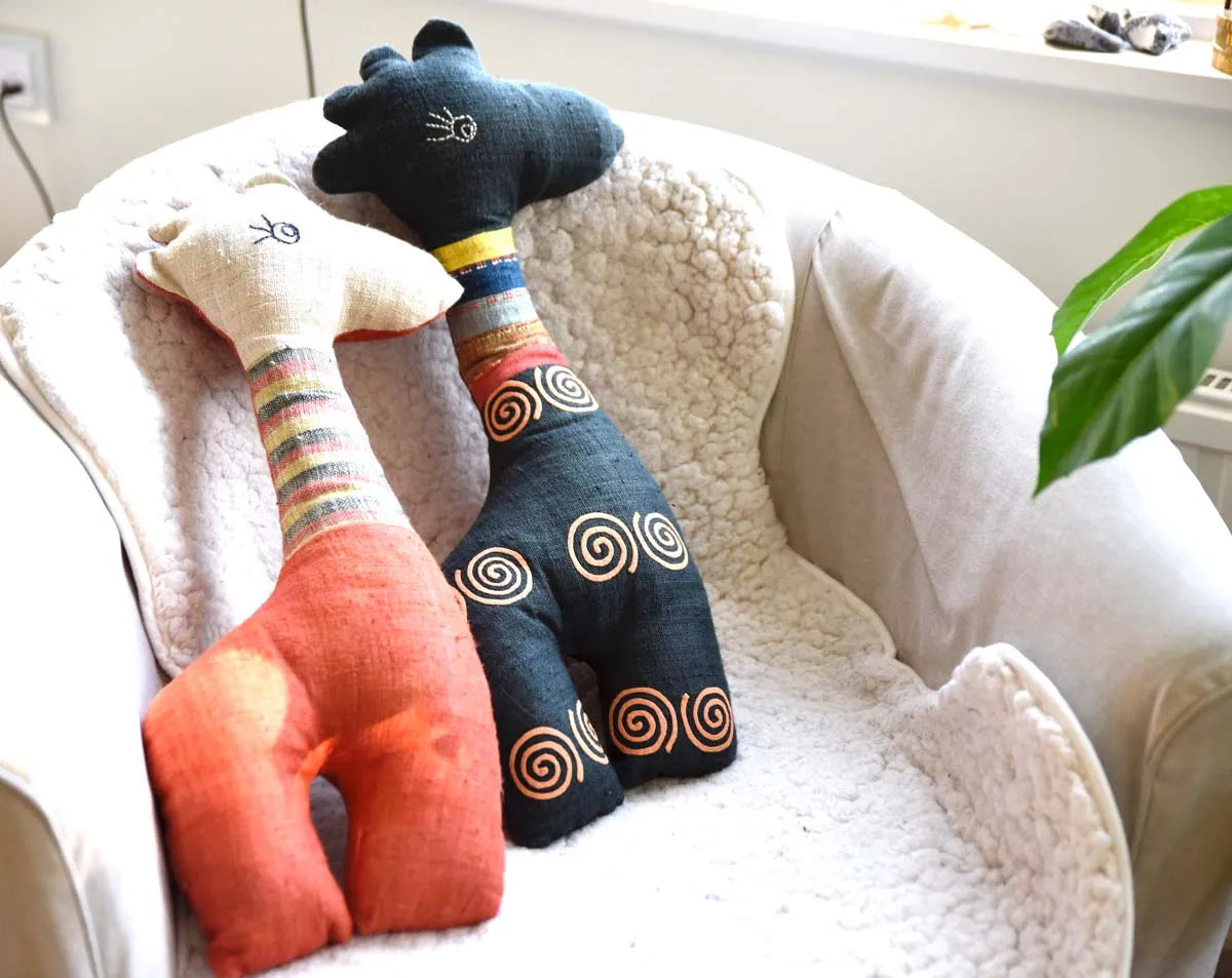 Pair of Vindigo hemp deer toys in orange and black colors