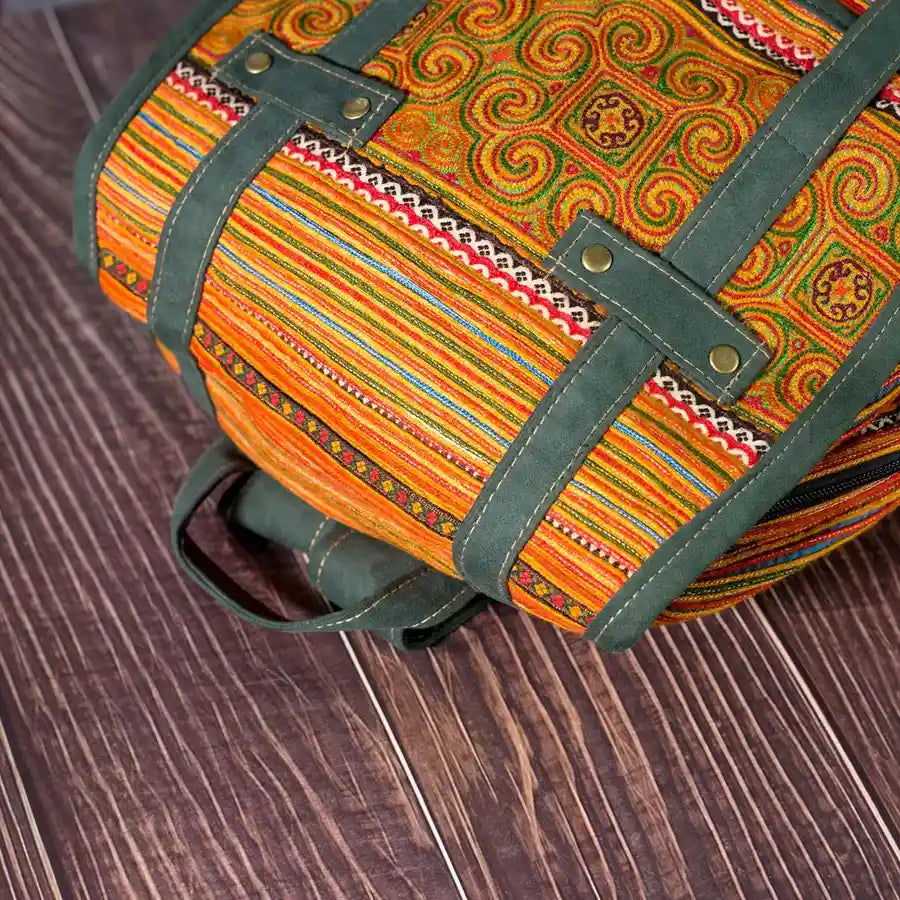 Vindigo yellow embroidered cotton backpack angled pattern view