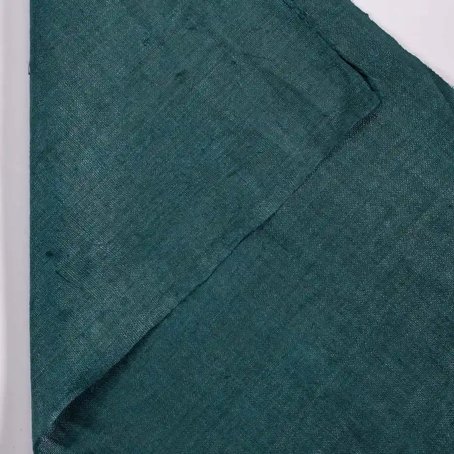 Vindigo plain green hemp fabric showing close texture