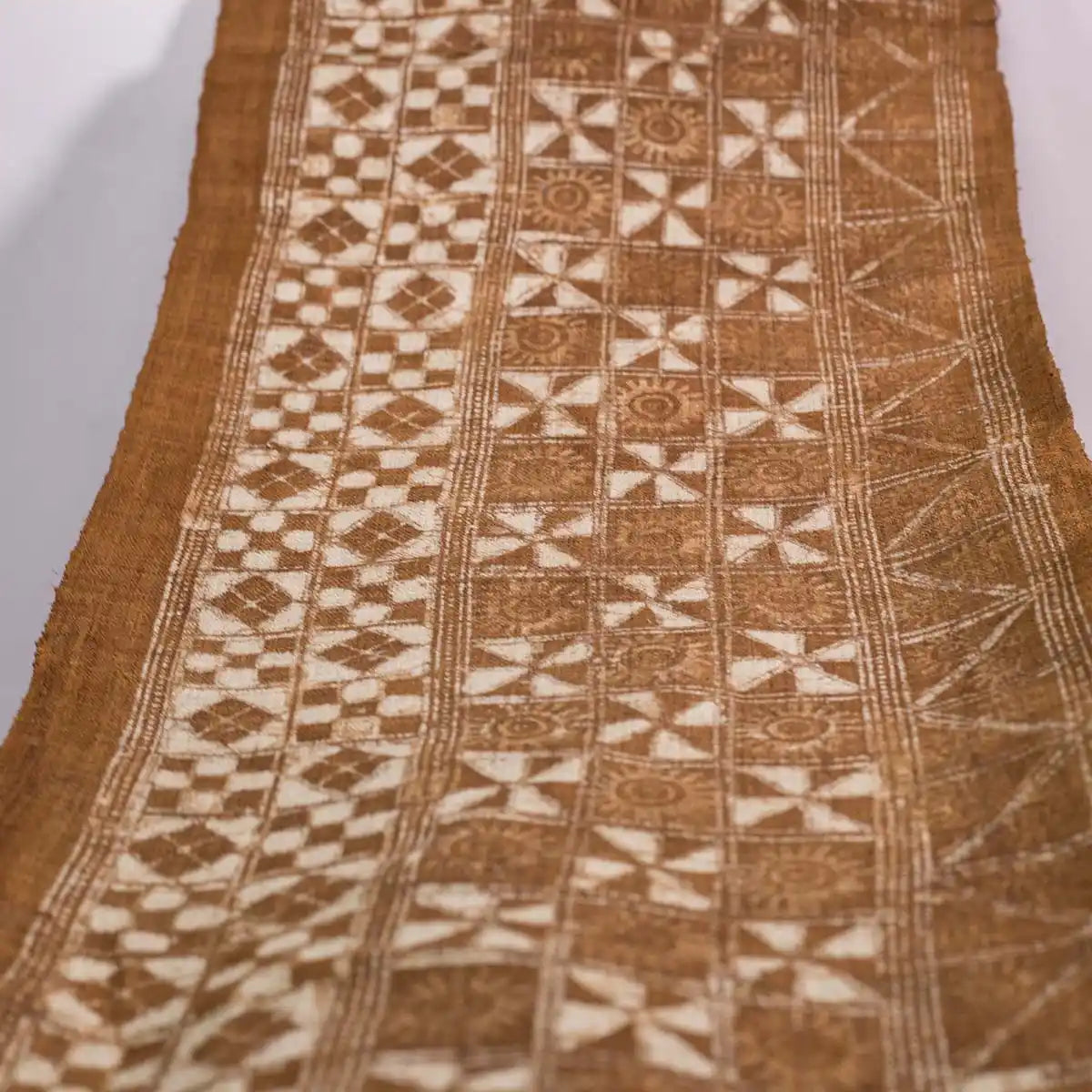 Vindigo brown ethnic geometric fabric roll full length view