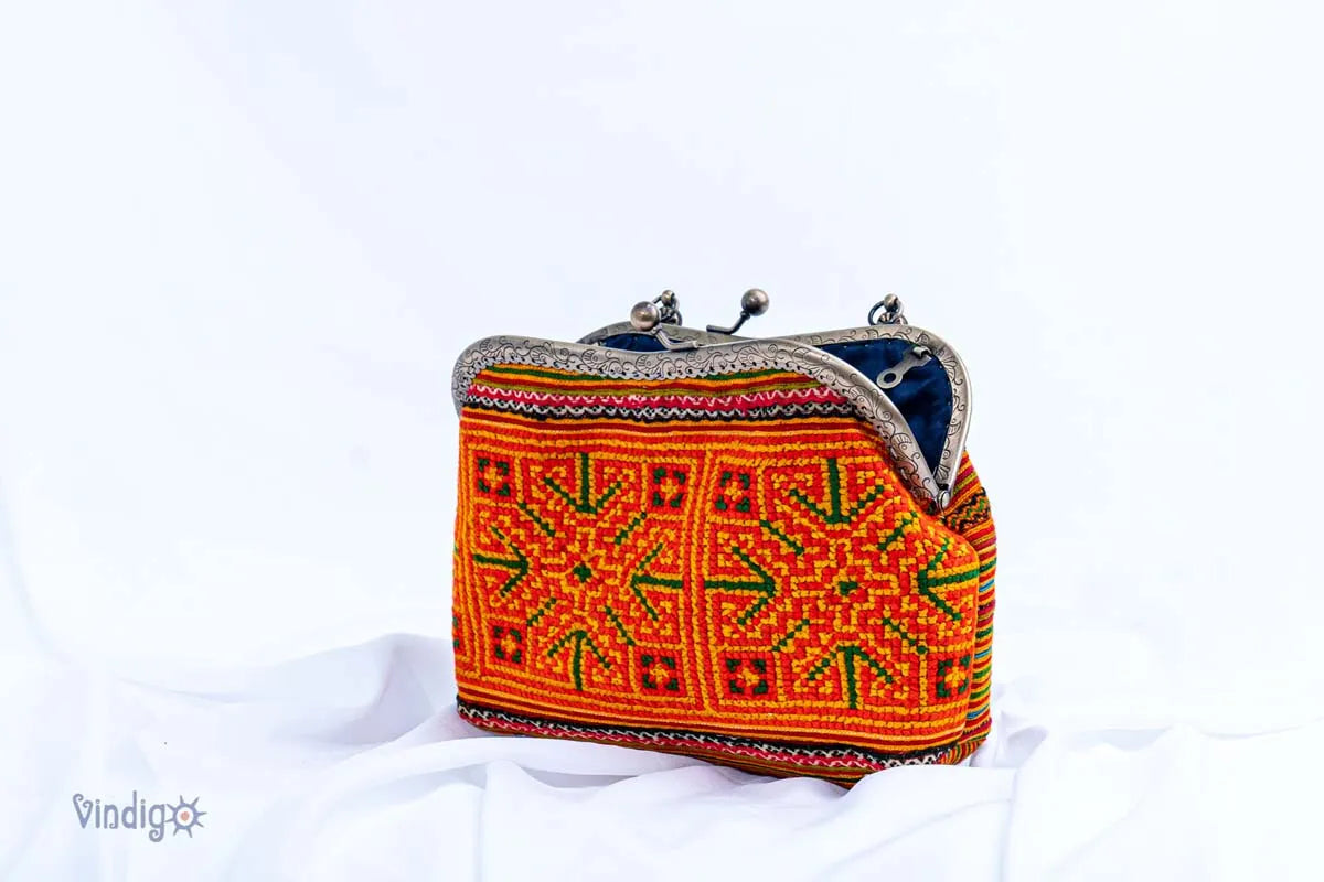 Vindigo cross-stitch embroidered handbag side angle view