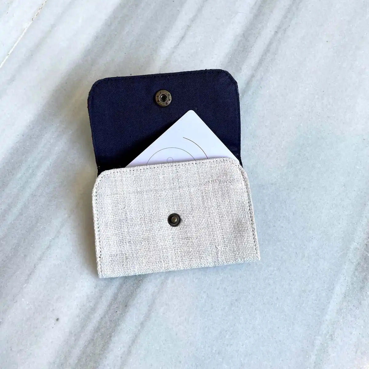 Vindigo open cardholder with visible slot and button clasp