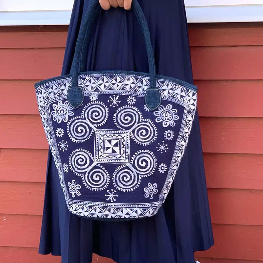 Vindigo spiral batik tote carried by model outdoors