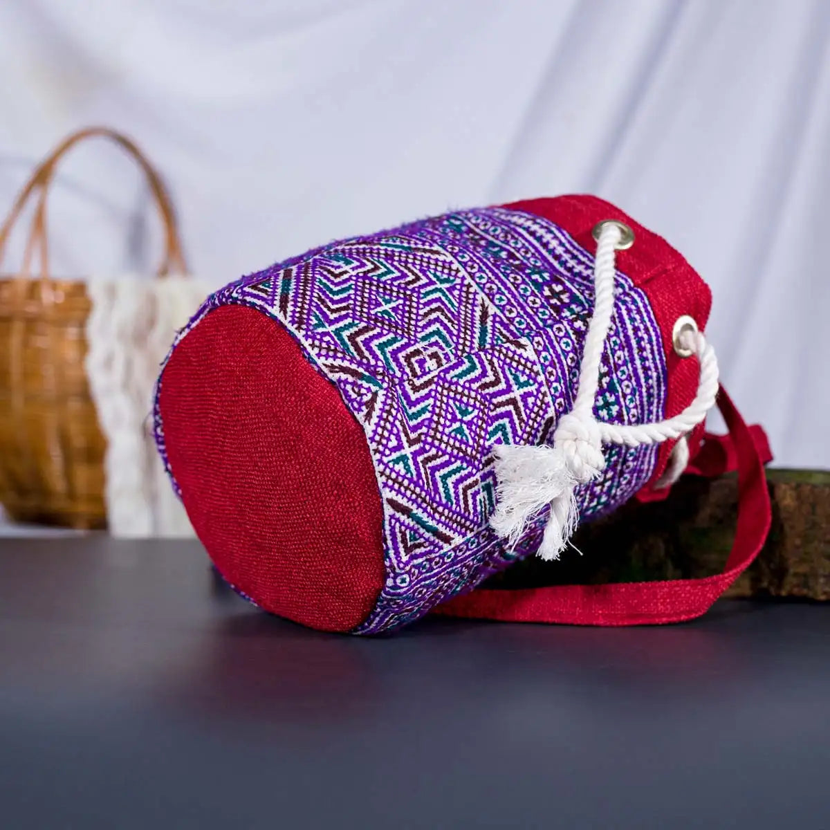 Bottom view of Vindigo red hemp geometric embroidered bucket bag