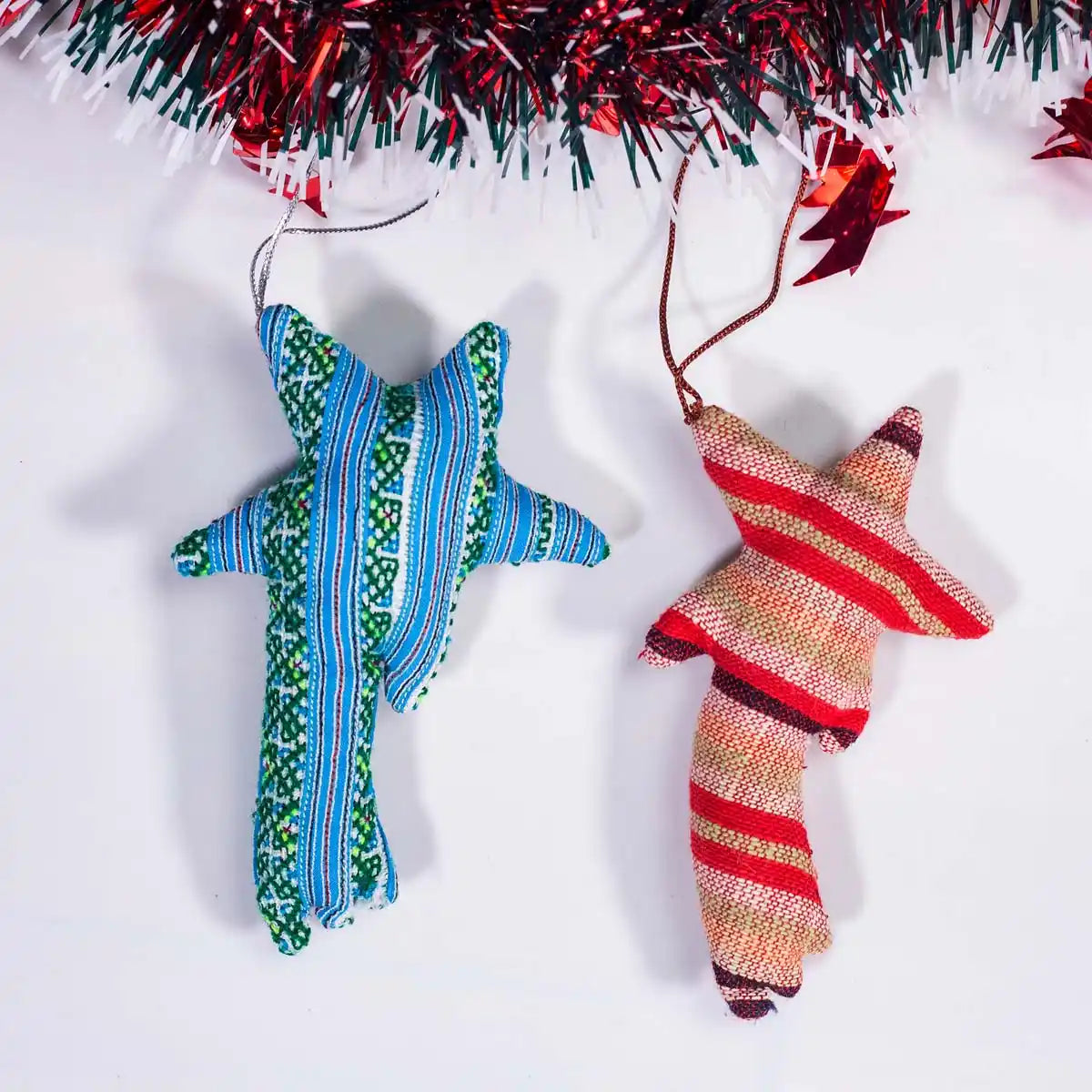Vindigo blue and red tribal embroidered star-shaped ornaments hanging together