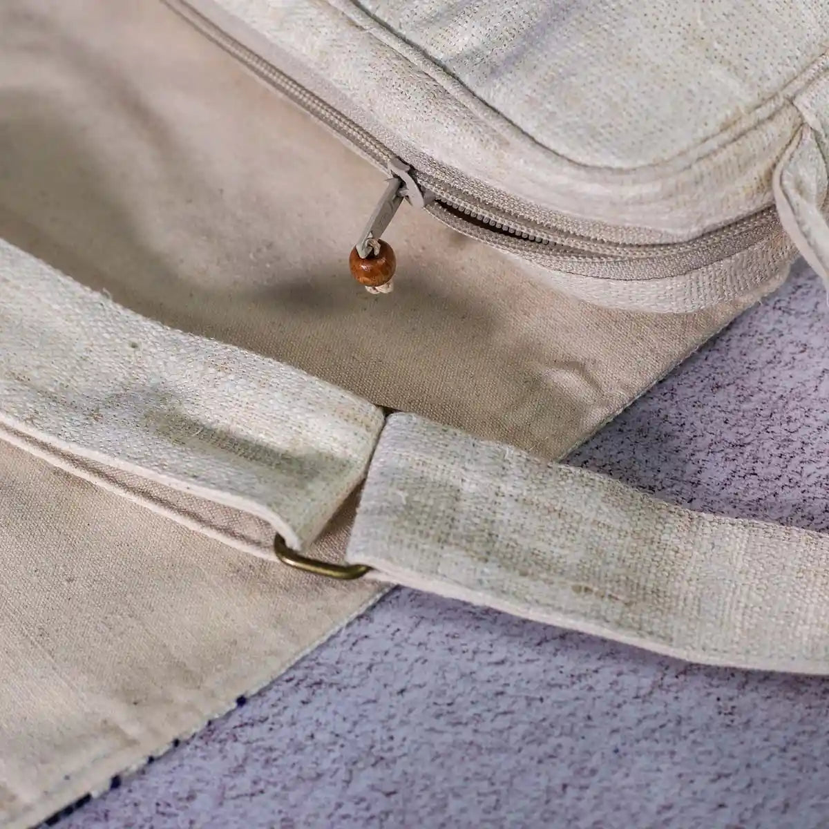 Vindigo hemp crossbody bag adjustable strap and zipper detail close-up