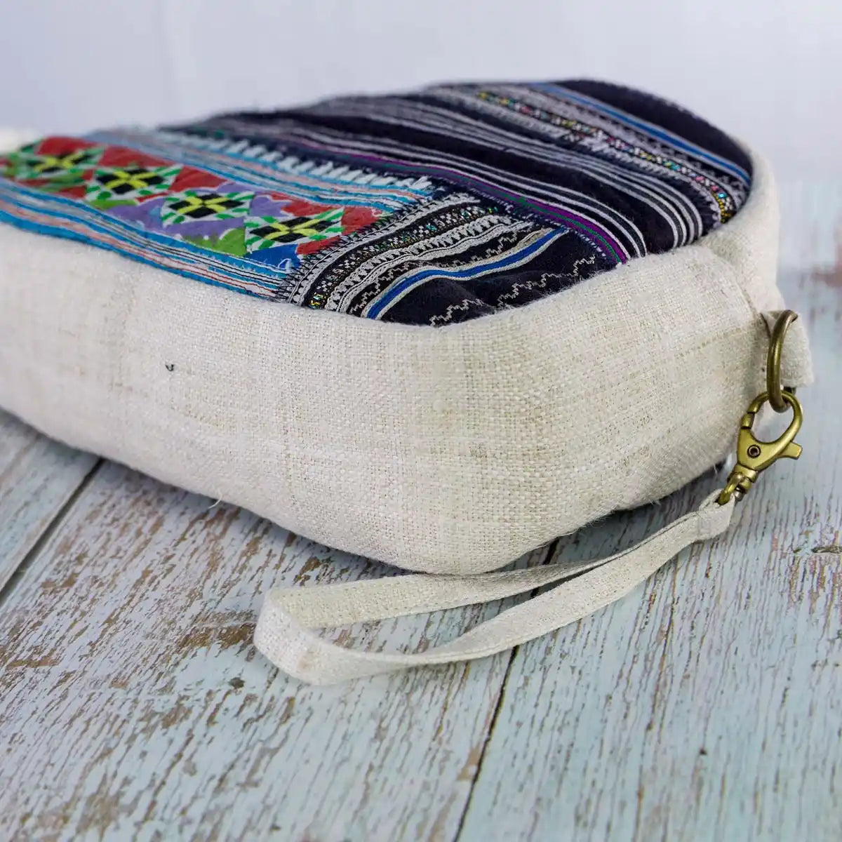 Vindigo beige hemp cosmetic bag side view featuring blue tribal woven fabric