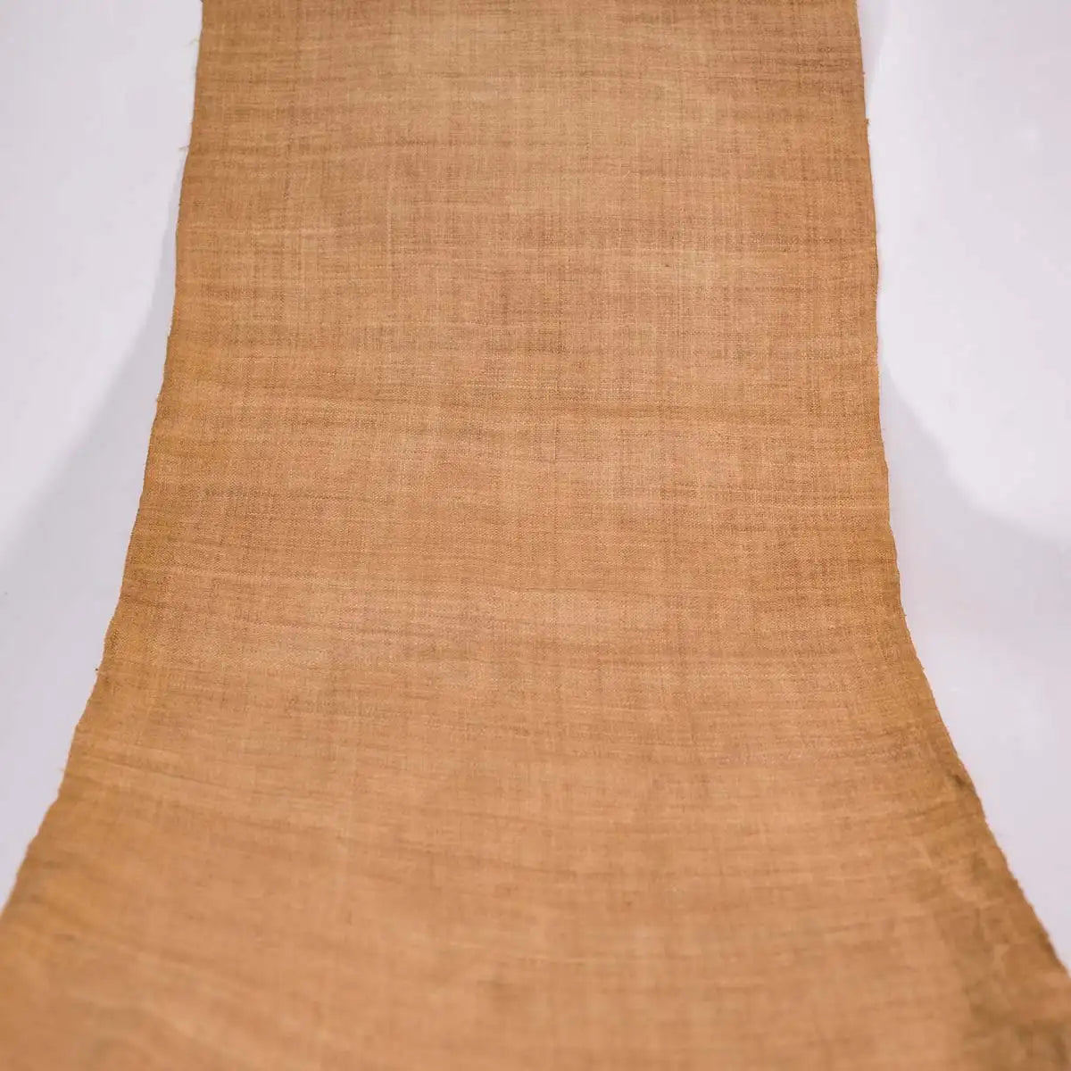 Vindigo natural hemp fabric roll extended on white background