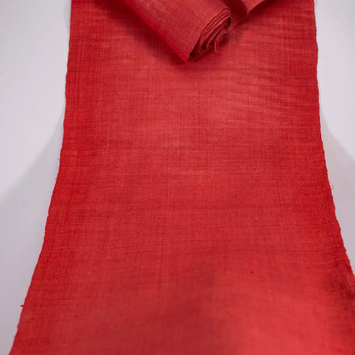 Vindigo plain red hemp fabric roll laid flat full length