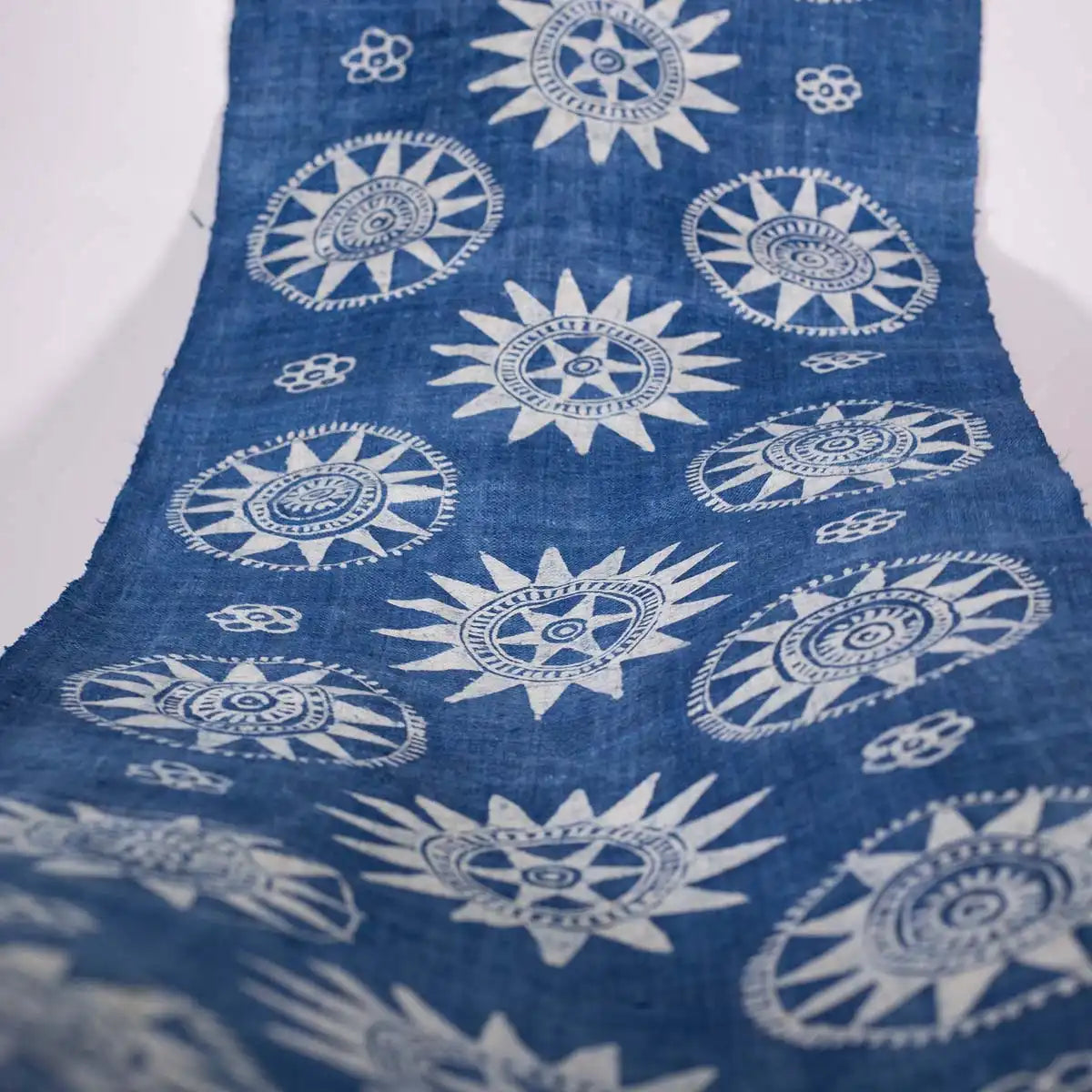 Vindigo indigo fabric roll top-down view with full sunflower layout