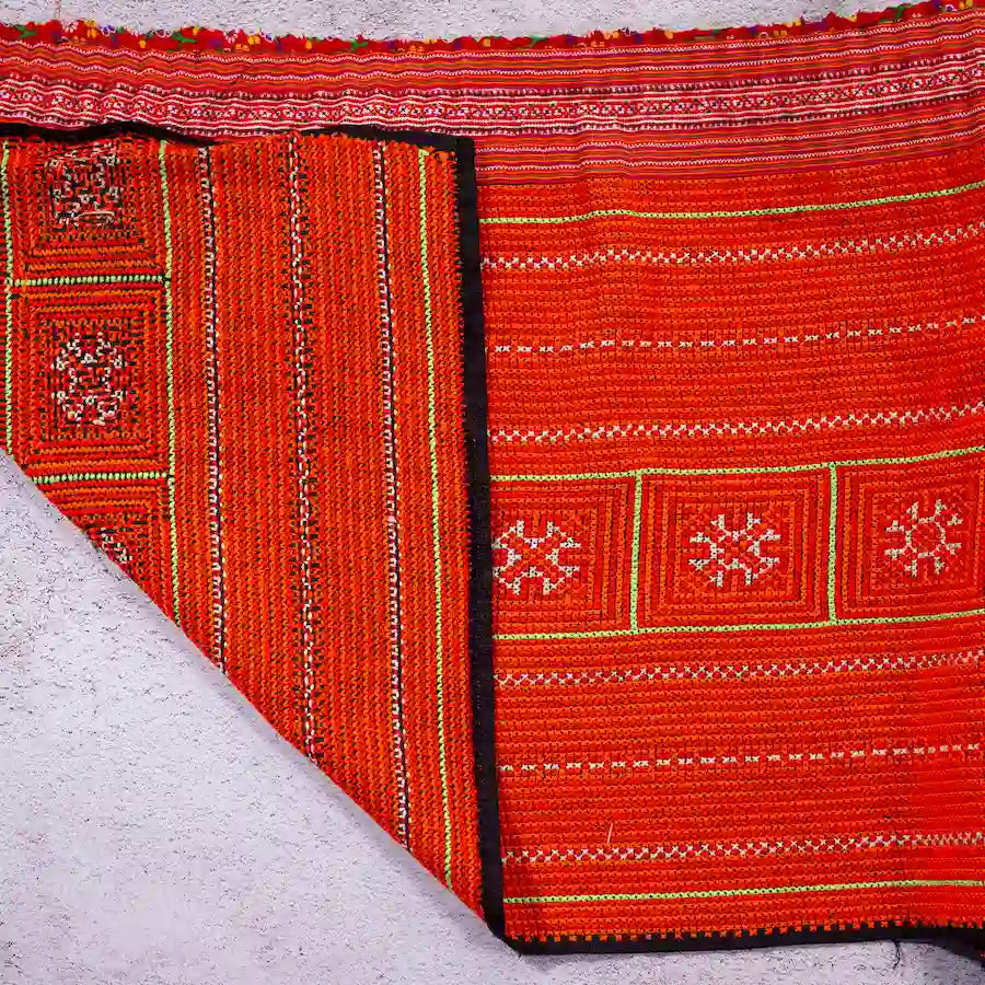 Vindigo red hemp embroidered fabric roll edge detail showing lining