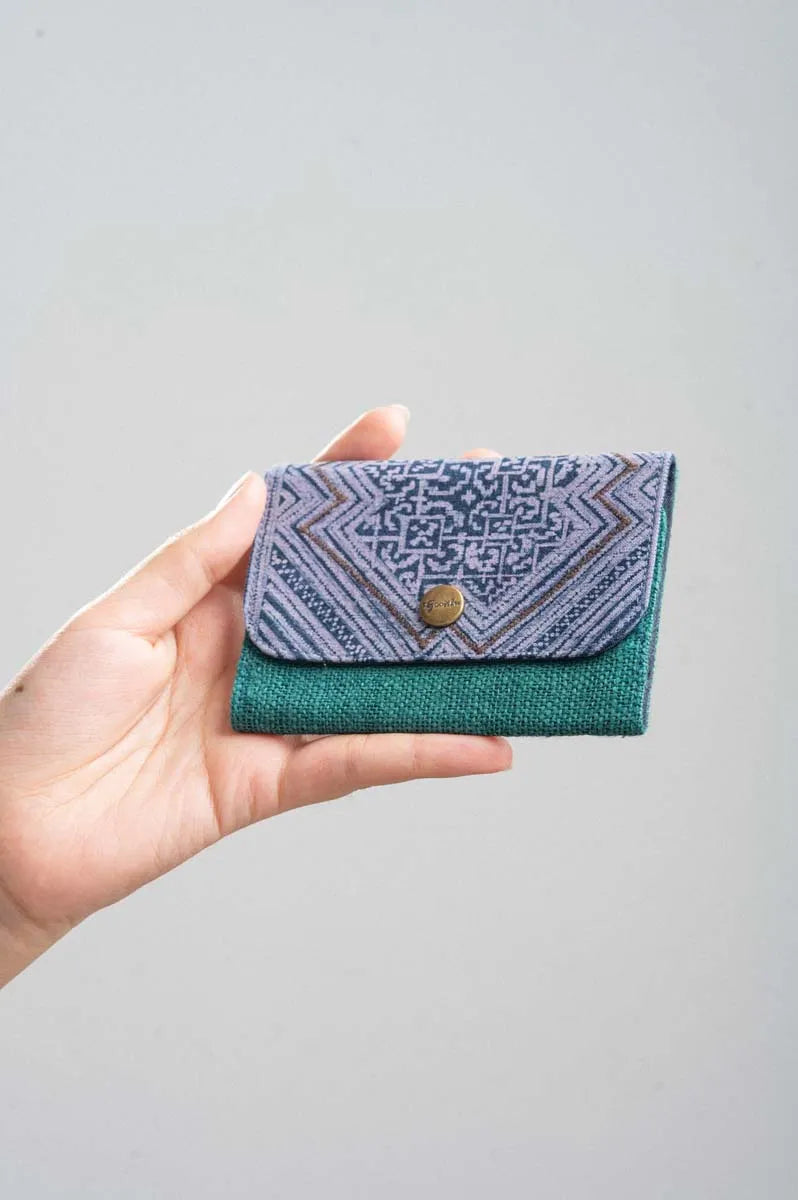 Vindigo green batik hemp cardholder with triangle pattern shown in hand