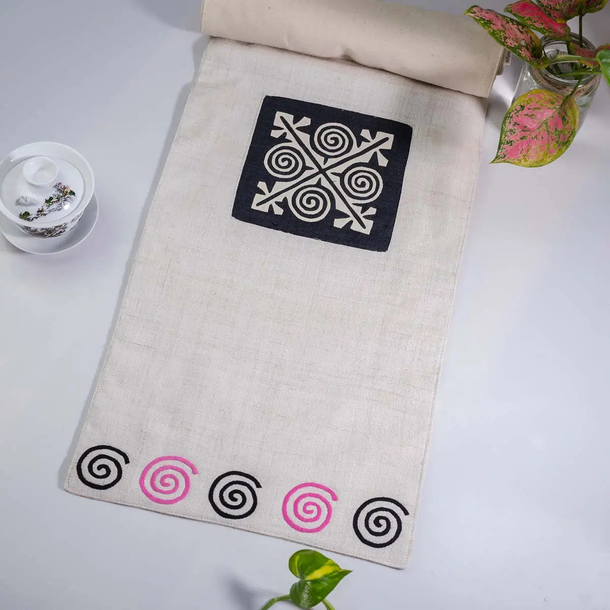 Vindigo beige hemp table runner full layout highlighting pink spiral border and central embroidery