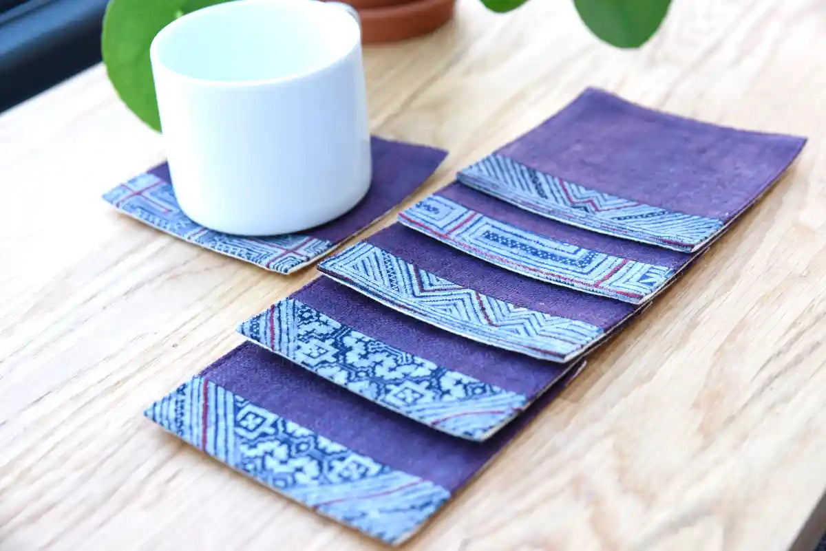 White cup on indigo hemp coaster with tribal pattern set