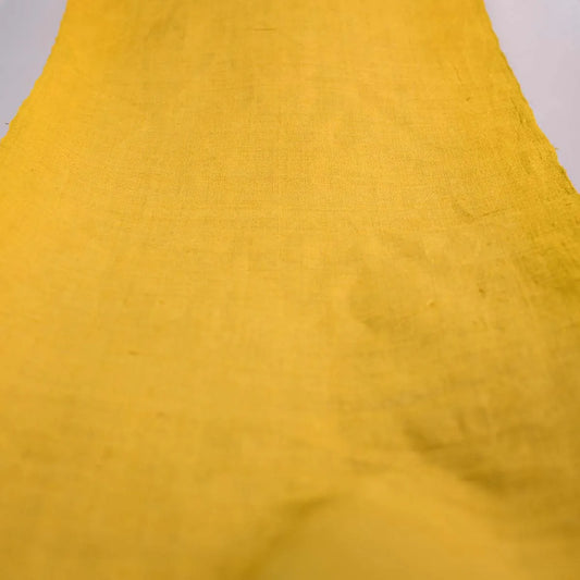 Vindigo natural yellow hemp fabric showing smooth texture