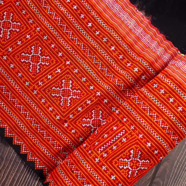 Vindigo red hemp tribal embroidered fabric folded showing pattern