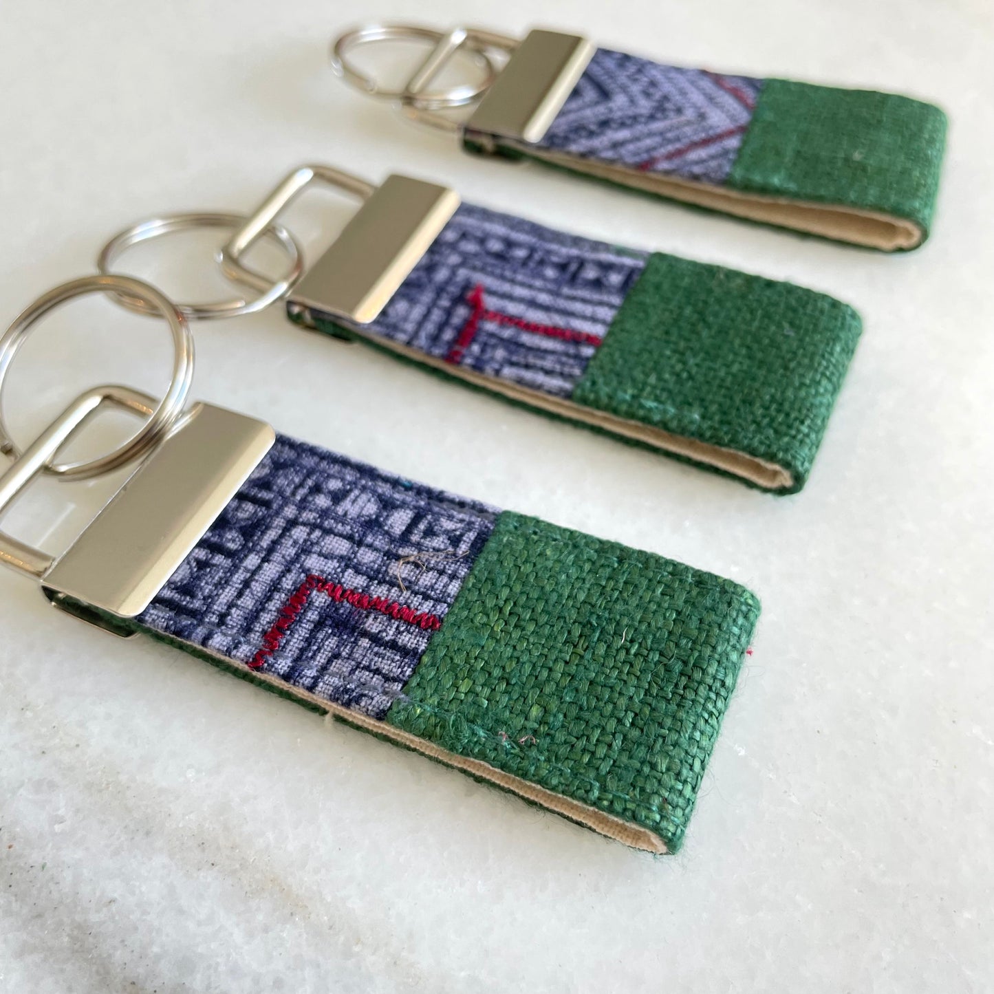 Classic green hemp fabric keychain with vintage batik patch, stainless metal key fob