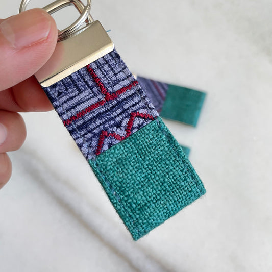 Emerald green hemp fabric keychain with vintage batik patch, stainless metal key fob
