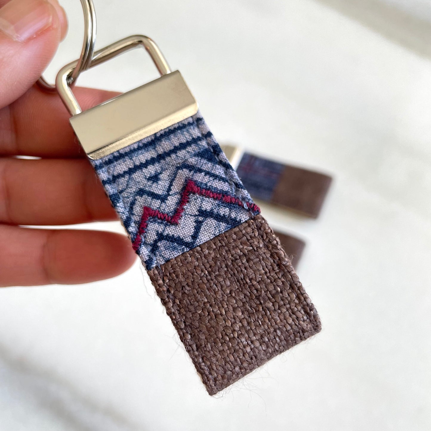 Dark brown hemp fabric keychain with vintage batik patch, stainless metal key fob