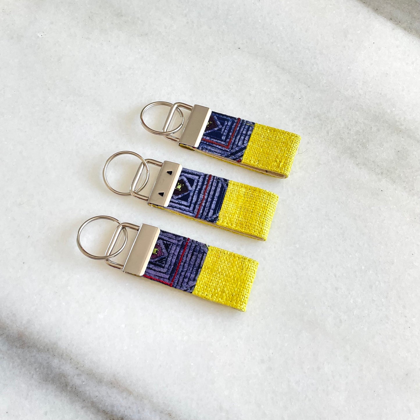 Bright yellow hemp fabric keychain with vintage batik patch, stainless metal key fob