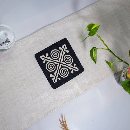 White Hemp Table Runner, patterns on black background, hand-stitched details at both ends
