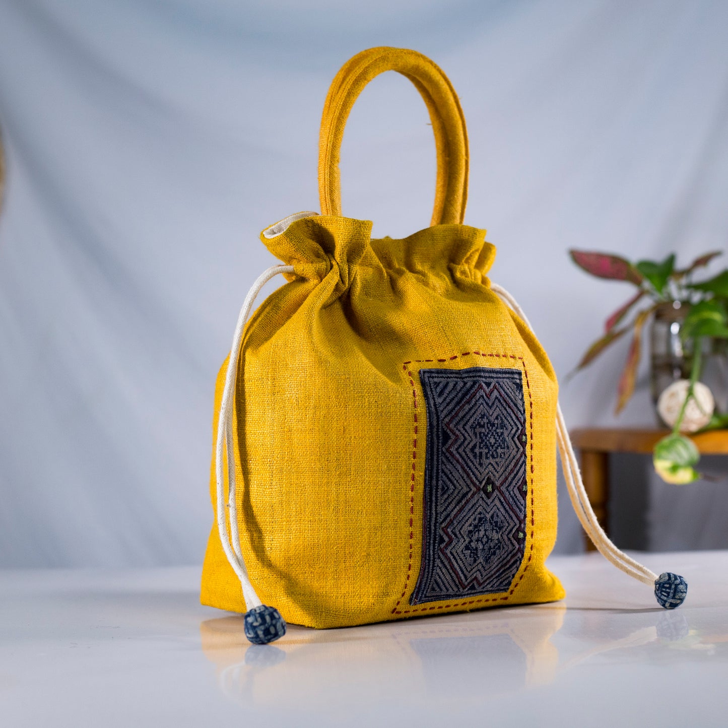 Yellow drawstring hemp handbag, natural hemp and batik patch