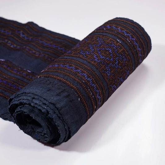 Vintage cross-stitch embroidery roll with shining brown and deep purple thread