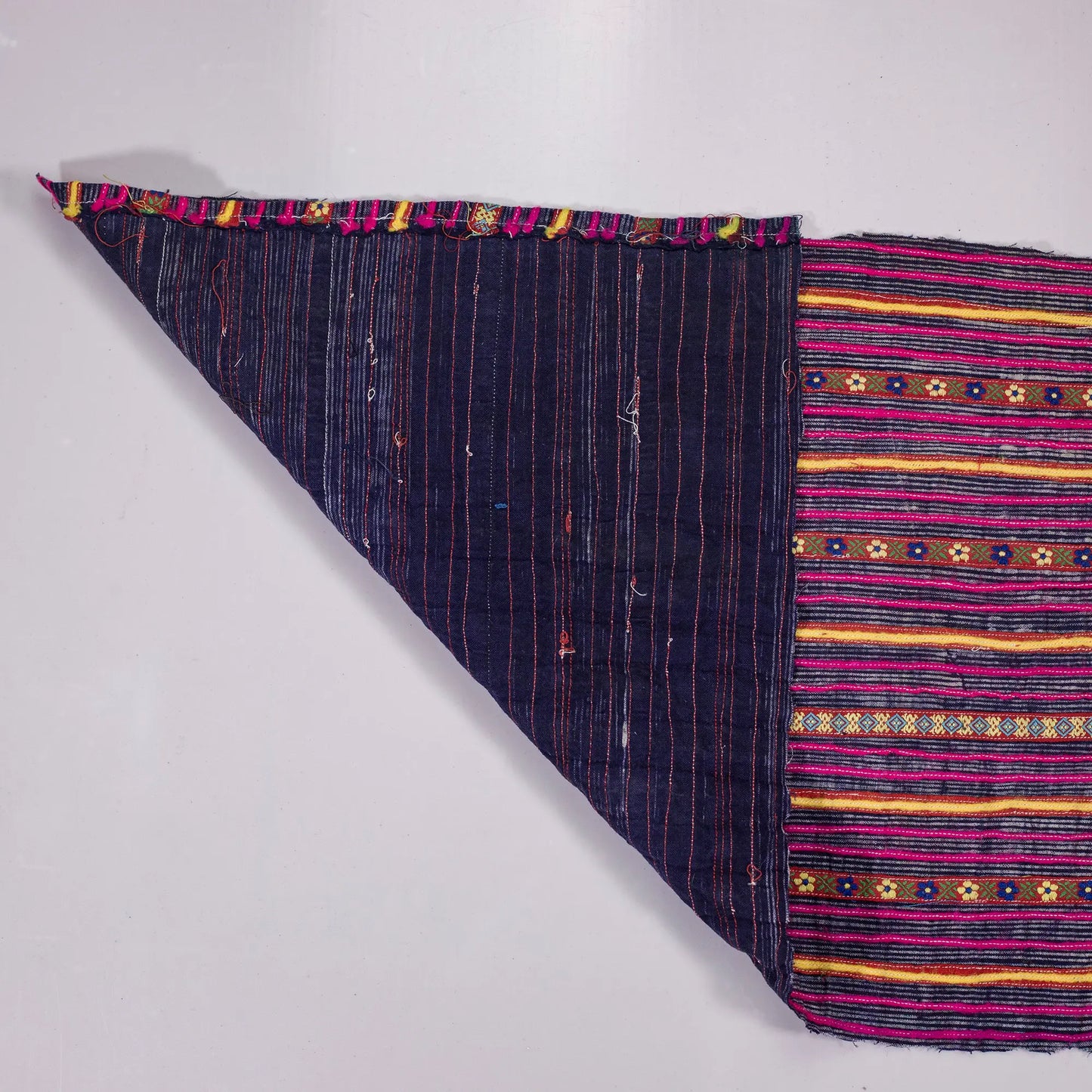 Vintage indigo rolls with pink stripes and tiny embroidery details