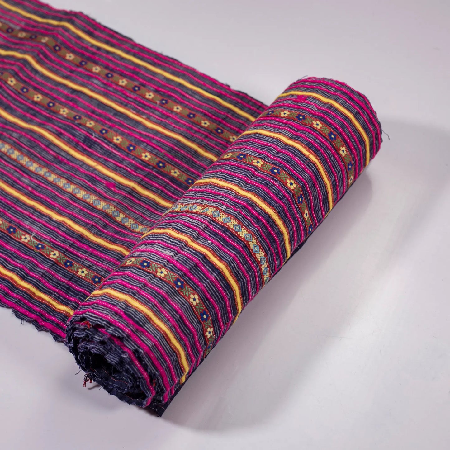Vintage indigo rolls with pink stripes and tiny embroidery details
