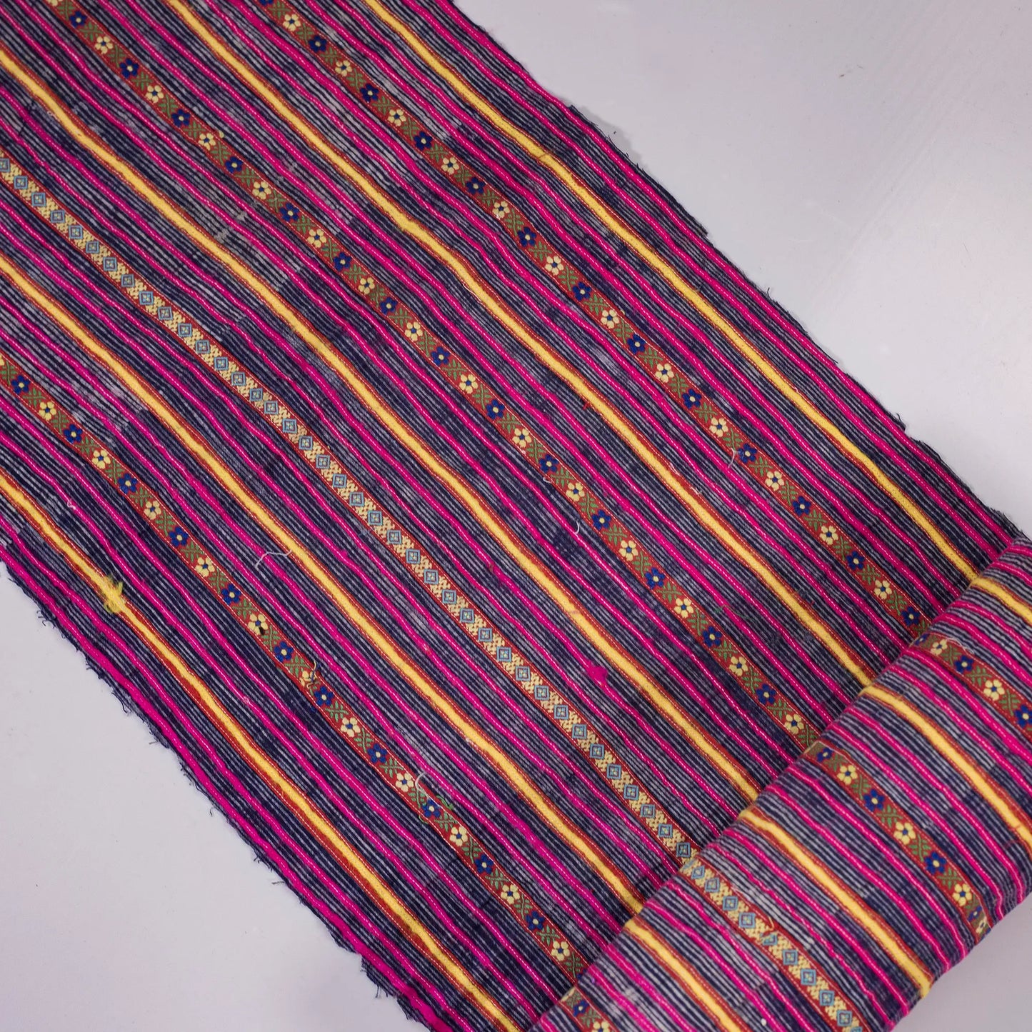 Vintage indigo rolls with pink stripes and tiny embroidery details