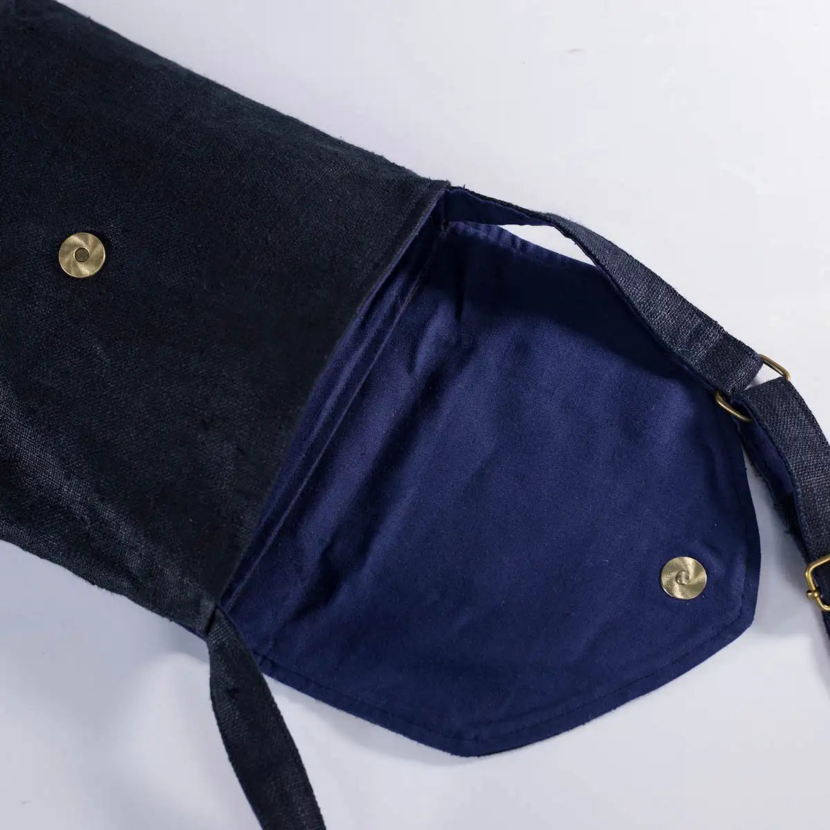 Interior view of black hemp crossbody bag with soft lining and magnetic closure, spacious bag.