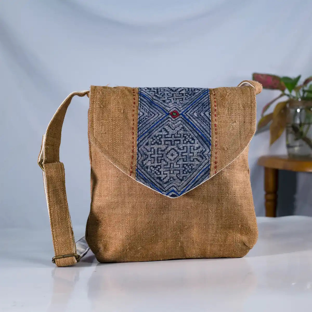 Front view of brown hemp crossbody bag with vintage patch, eco-friendly handmade design.