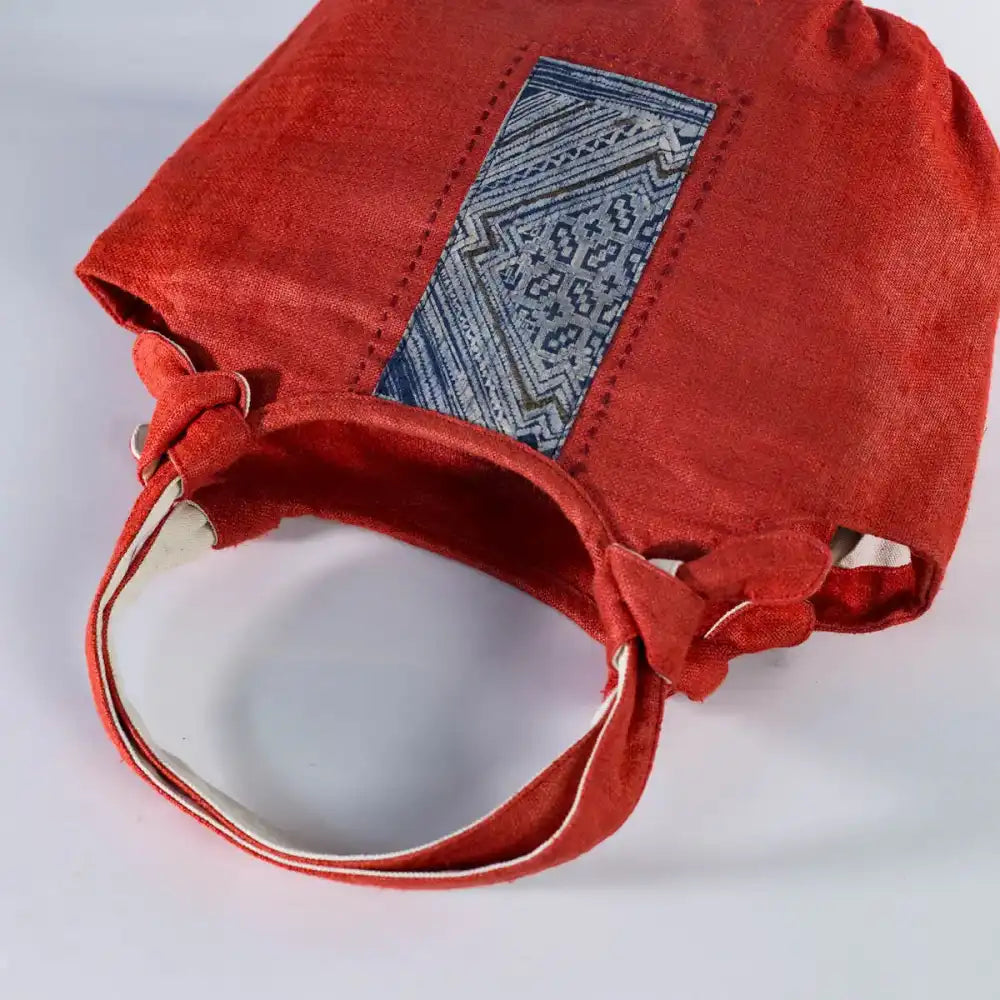 Inside view of red natural hemp bunny ear handbag with vintage H’Mong patch and cotton lining