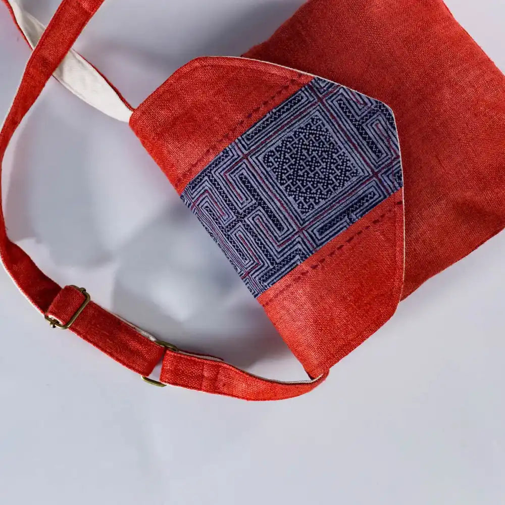 Inside view of red hemp cross-body bag with cotton lining and vintage H’Mong patch