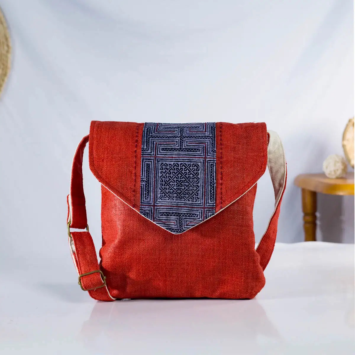 Side view of red hemp cross-body bag with vintage H’Mong patch, handmade Purity Collection bag