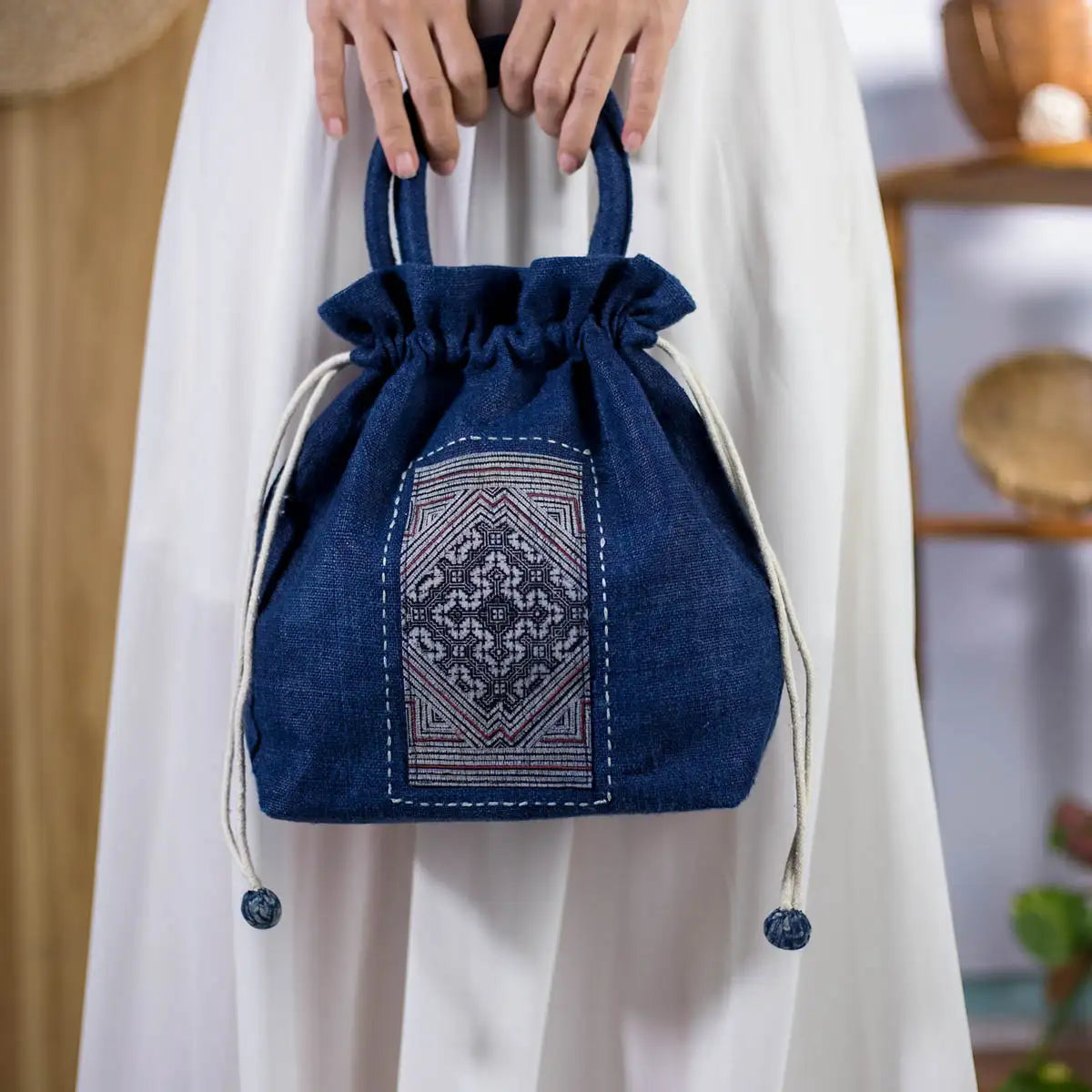 Handmade hemp bucket bag in indigo blue with authentic H’mong patch, eco-friendly