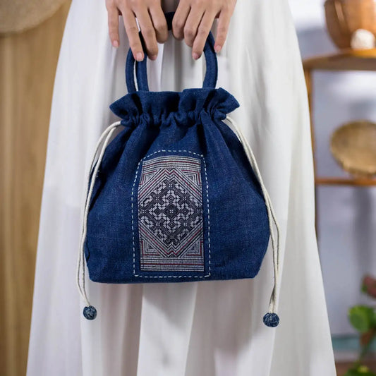Handmade hemp bucket bag in indigo blue with authentic H’mong patch, eco-friendly