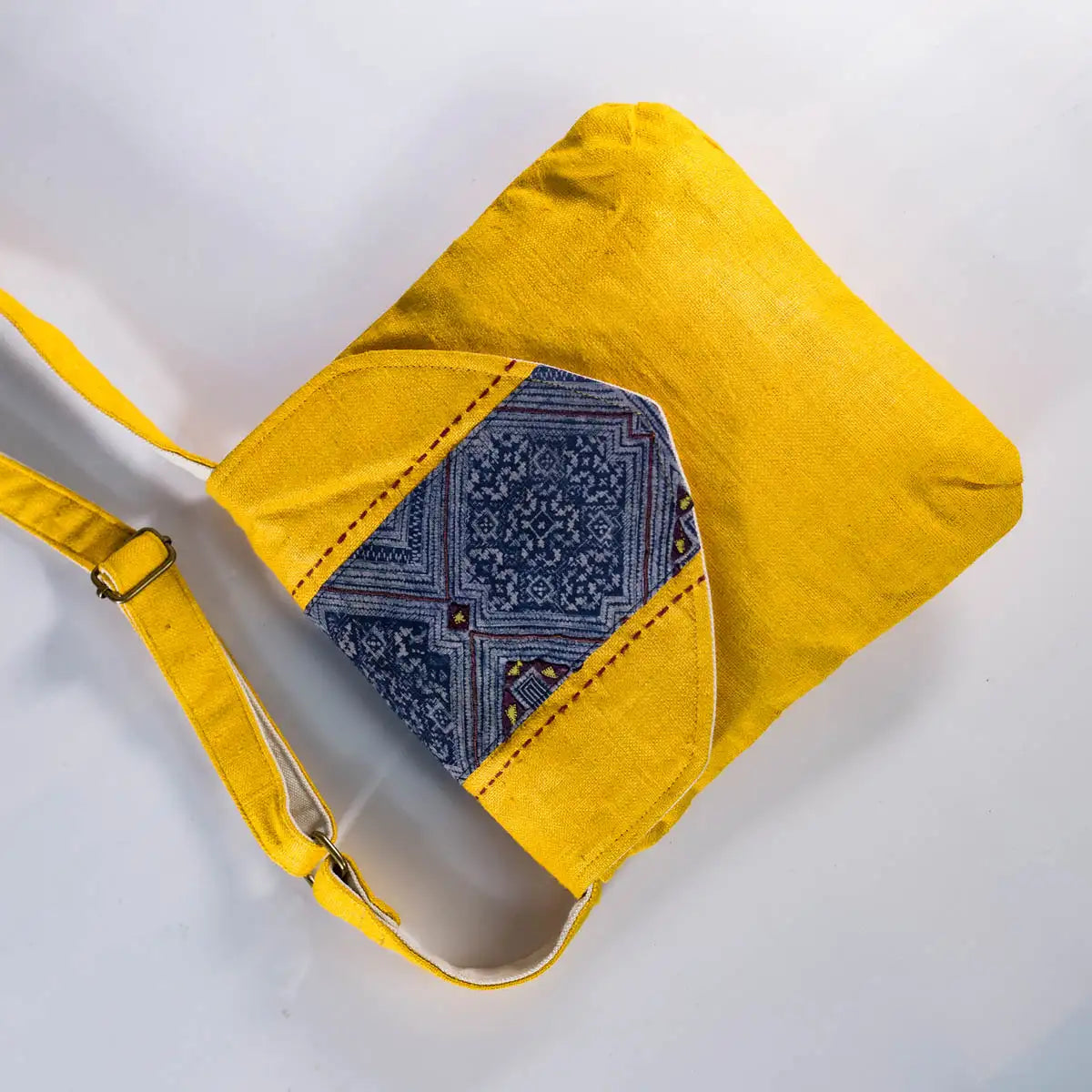 Side view of eco hemp crossbody bag in yellow with adjustable strap
