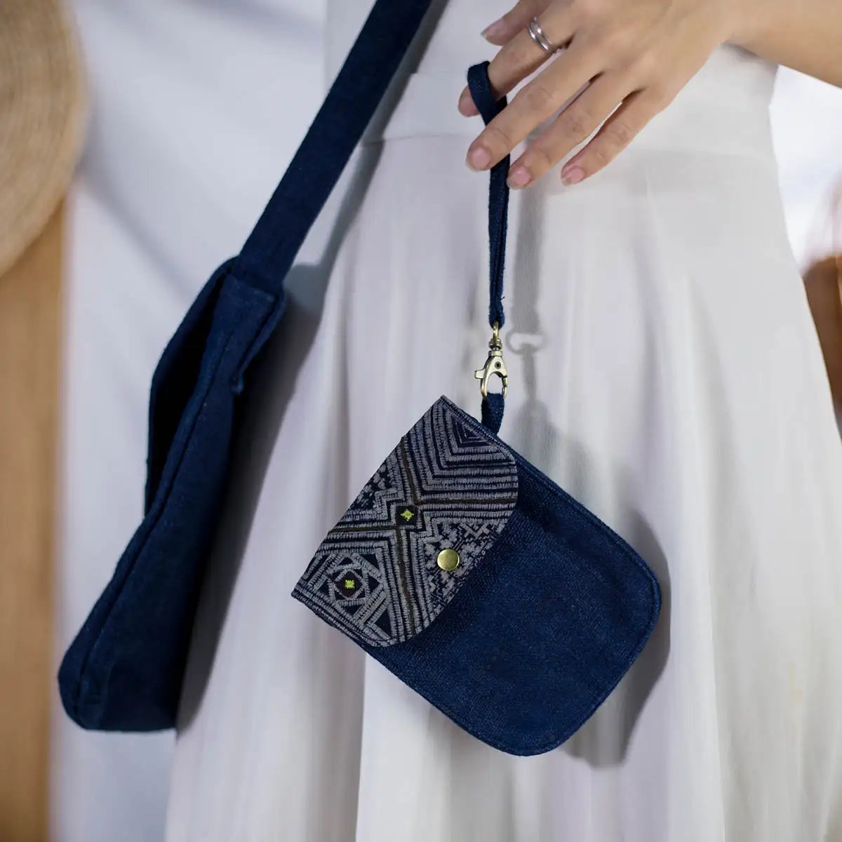 Front view of indigo hemp mobilväska phone bag with strap and H’mong patch for daily essentials.