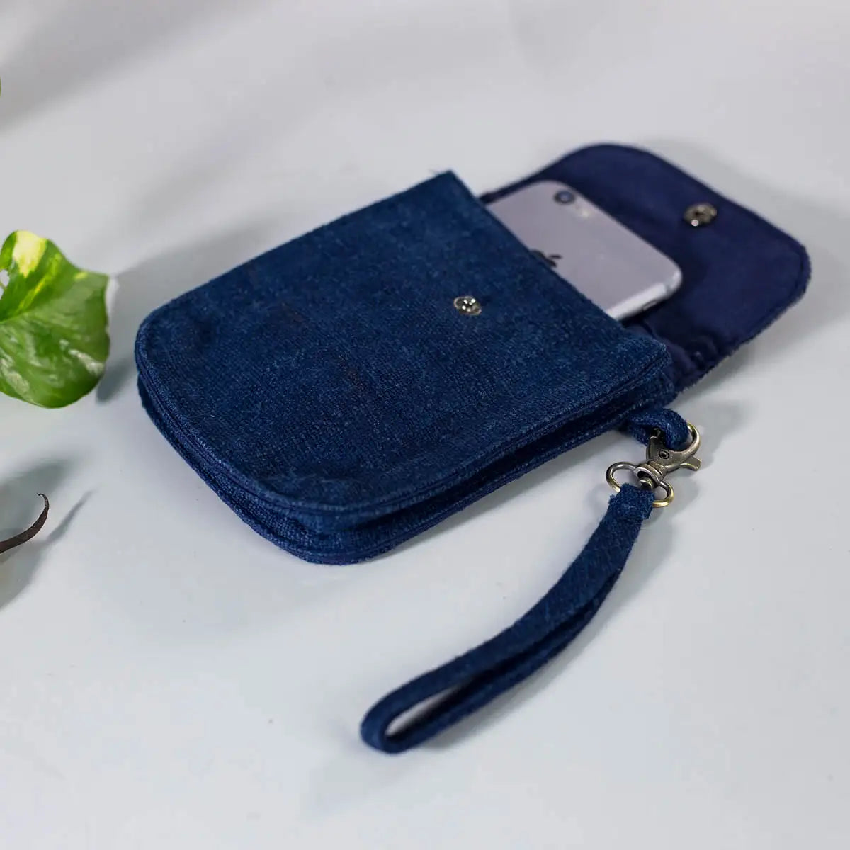 Top view of indigo hemp mobilväska phone bag with strap and drawstring, handmade craftsmanship.