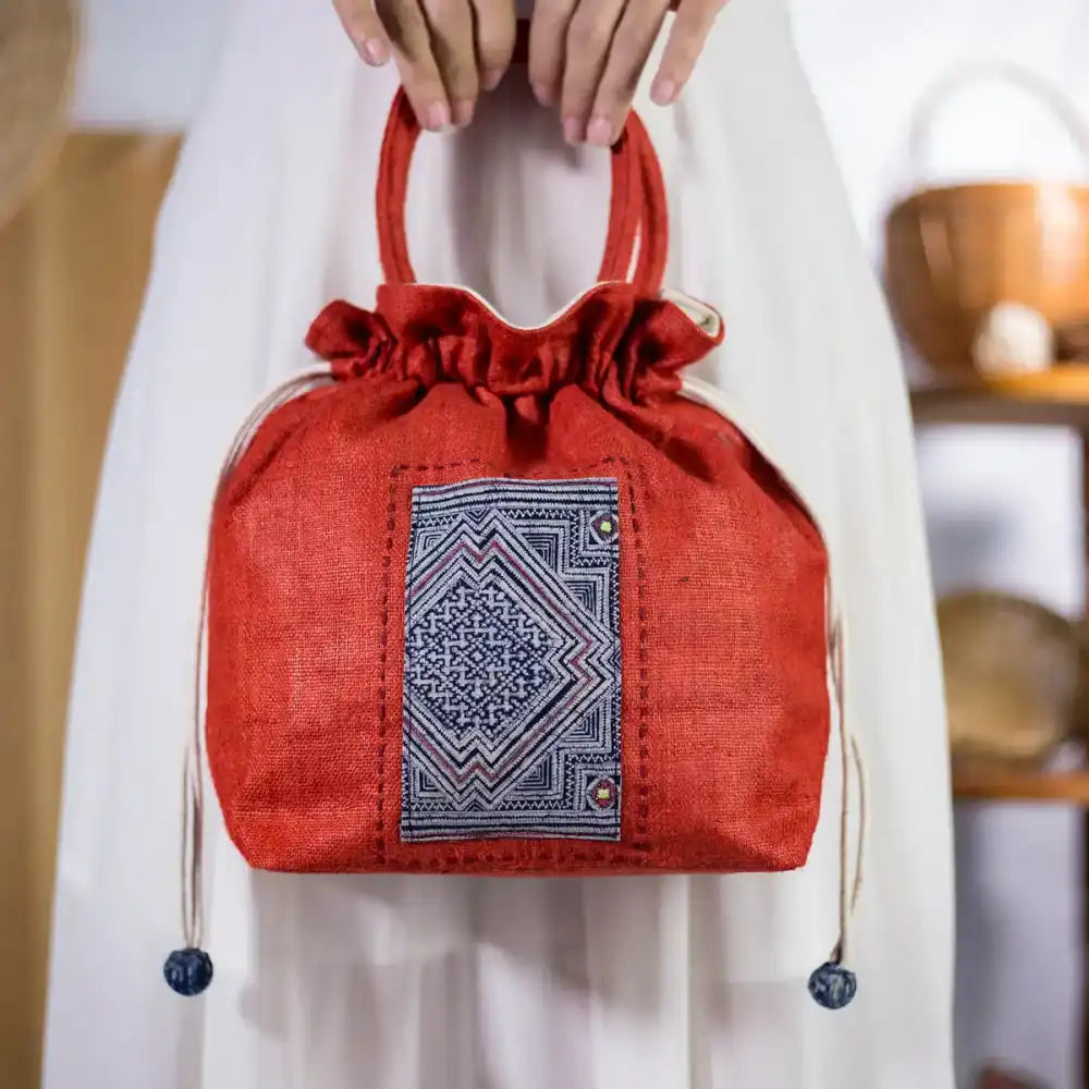 Red hemp bucket bag with authentic H’mong patch, artisan-made eco-friendly handbag